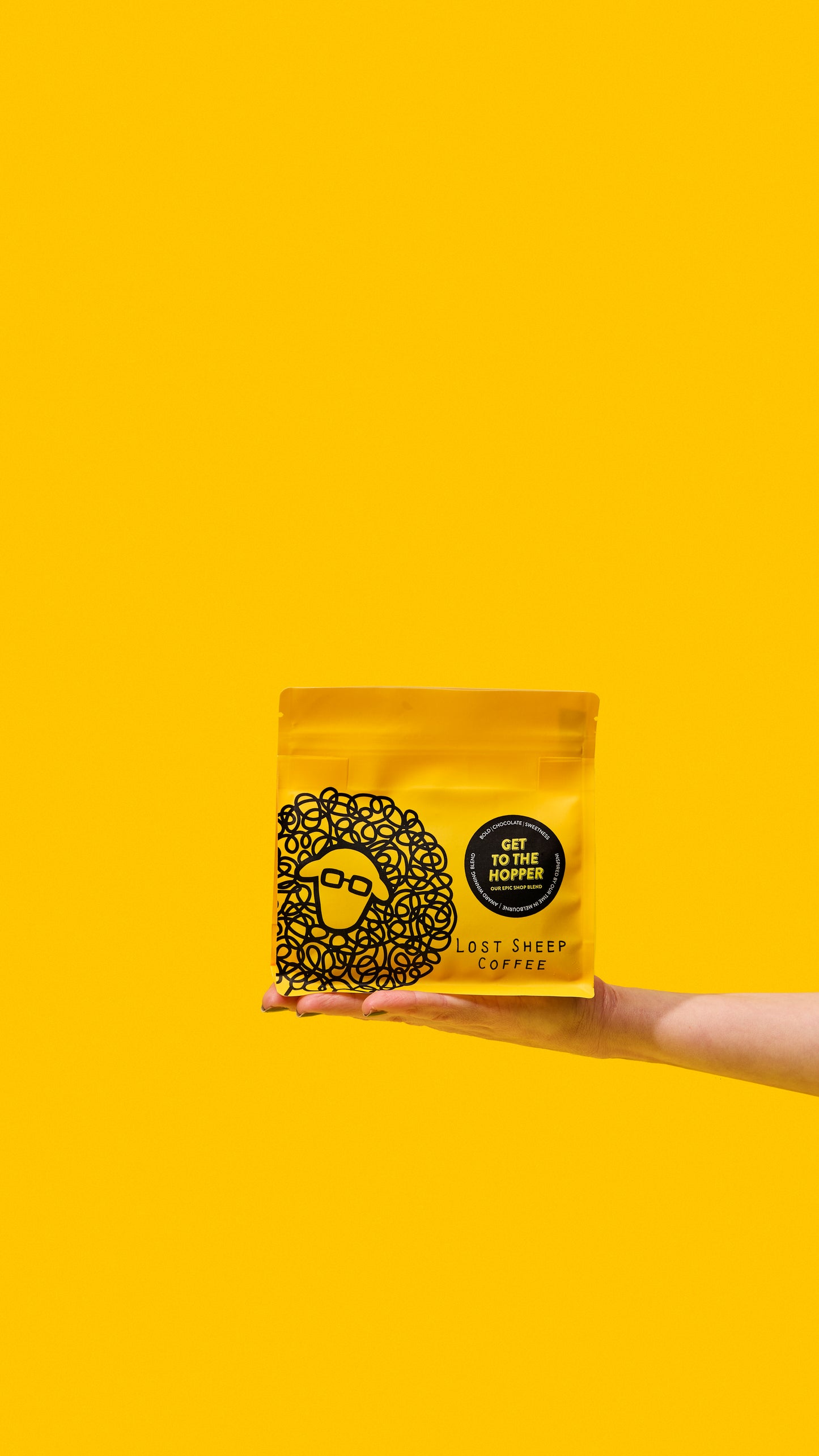 Lost Sheep coffee's award winning Get to the Hopper packaging against a yellow background.