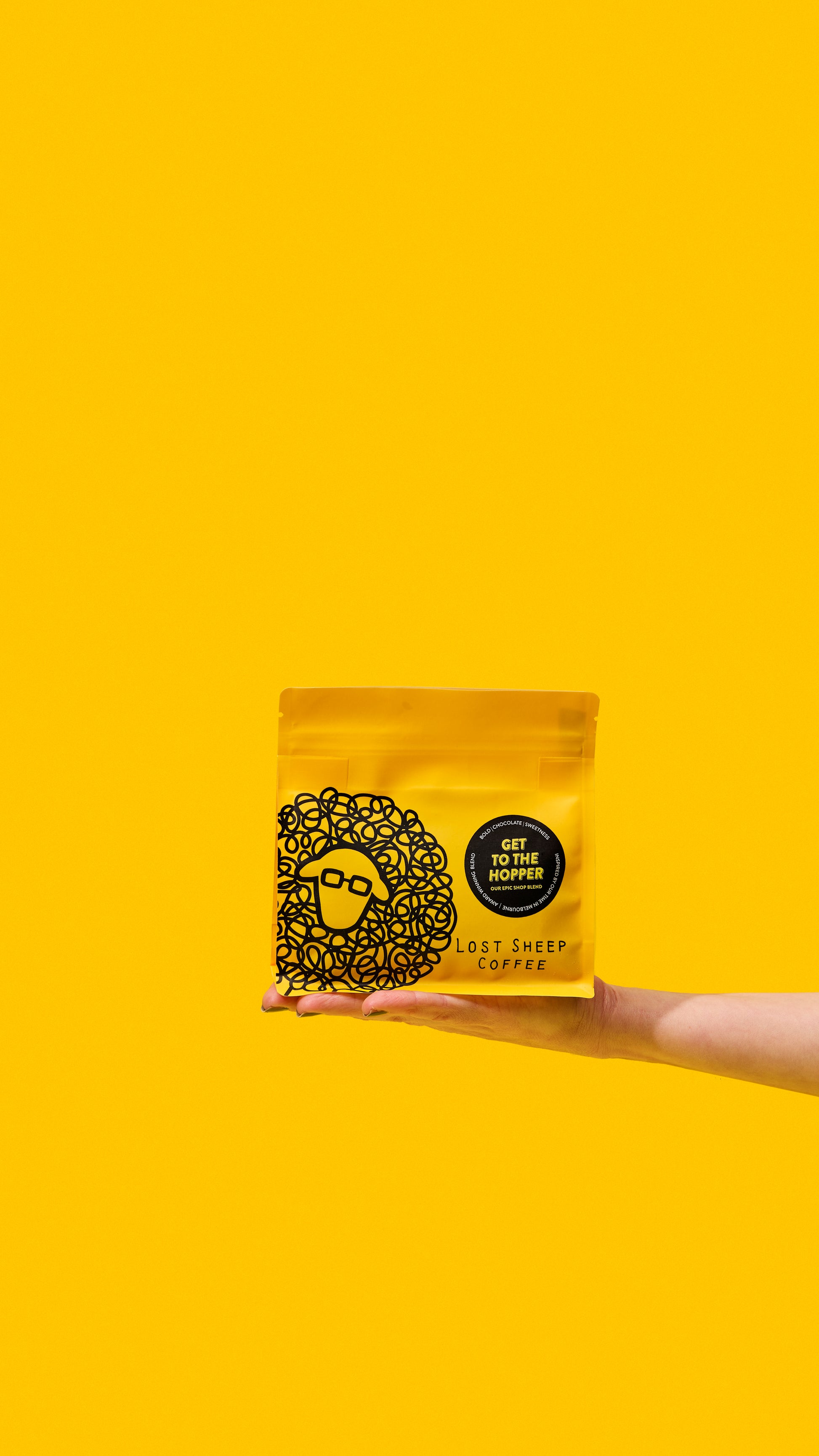 Lost Sheep coffee's award winning Get to the Hopper packaging against a yellow background.