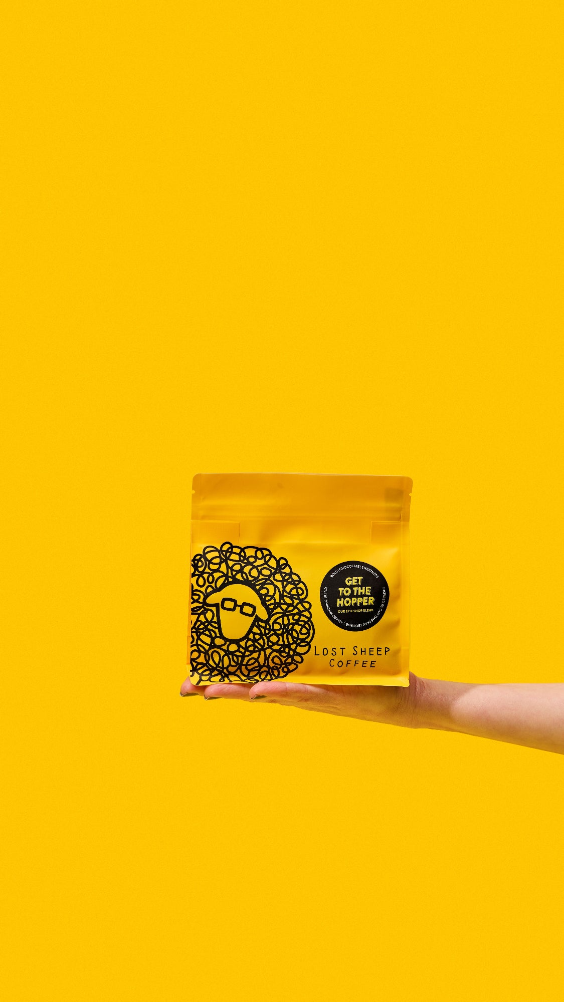 Lost Sheep coffee's award winning Get to the Hopper packaging against a yellow background.