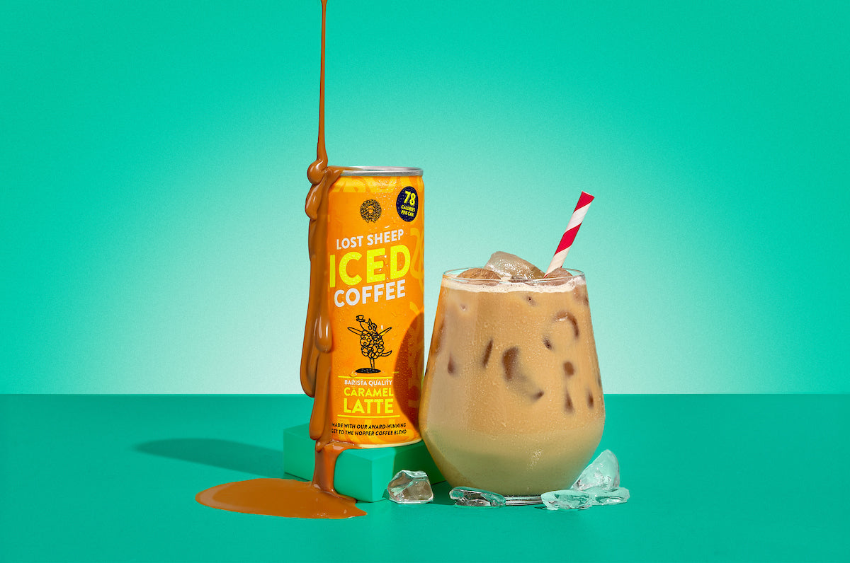 Lost Sheep iced coffee Caramel Latte against a teal background.