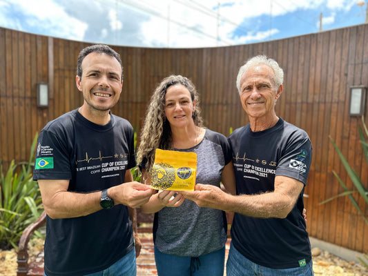 barbosa family holding a bag of lost sheep coffee