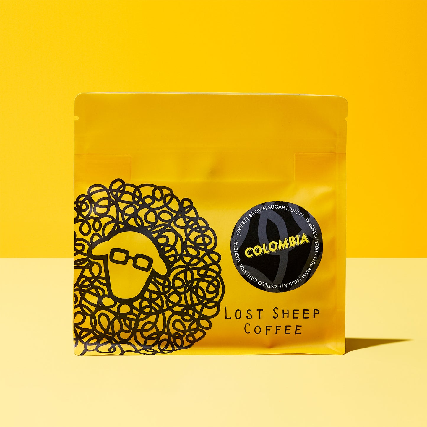 Colombia Huila coffee beans in yellow Lost Sheep Coffee packaging